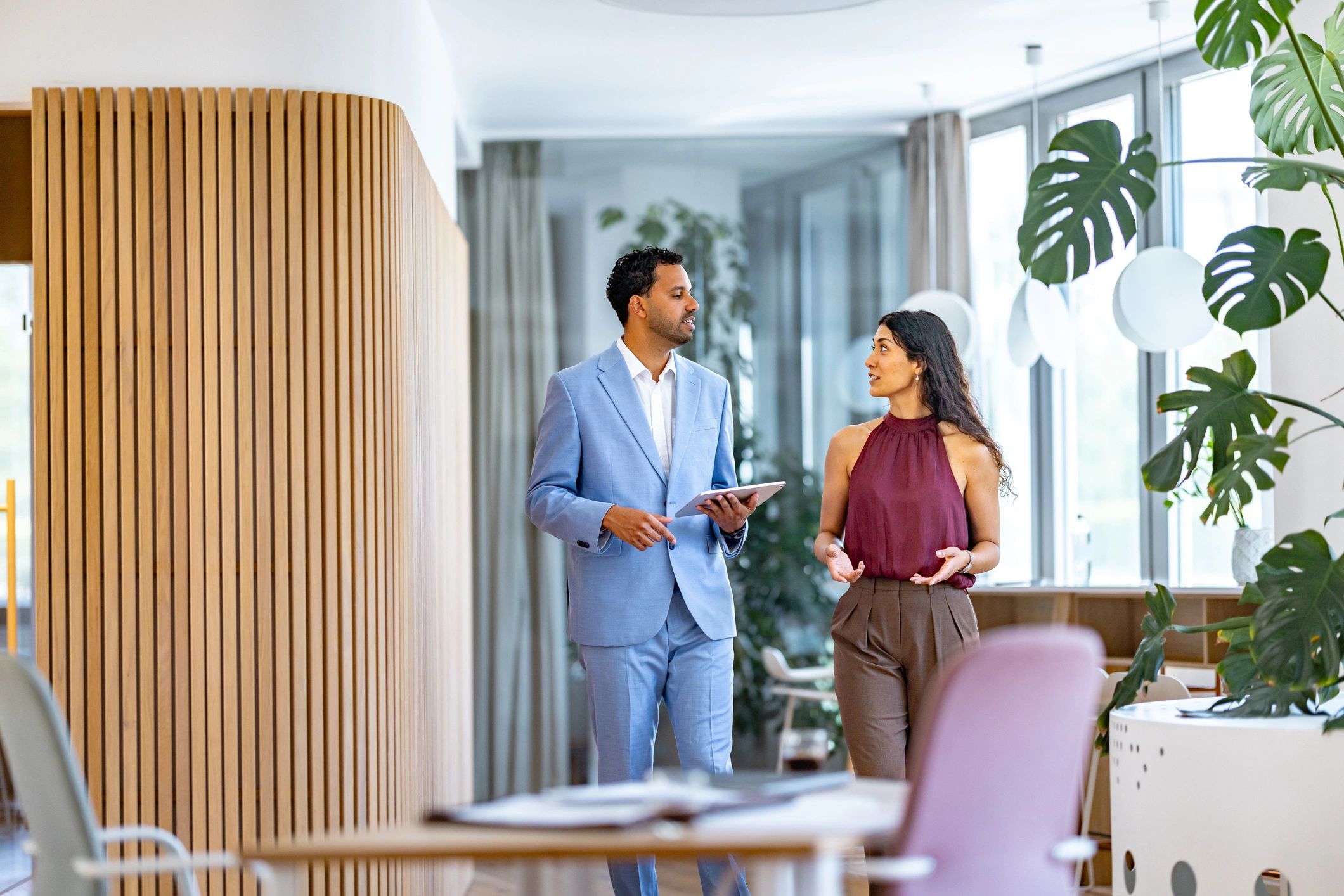 Real estate professionals discussing client requirements